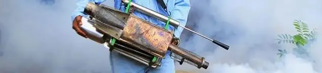 Fumigation technician using a fogger for deep pest treatment in Atlanta, GA